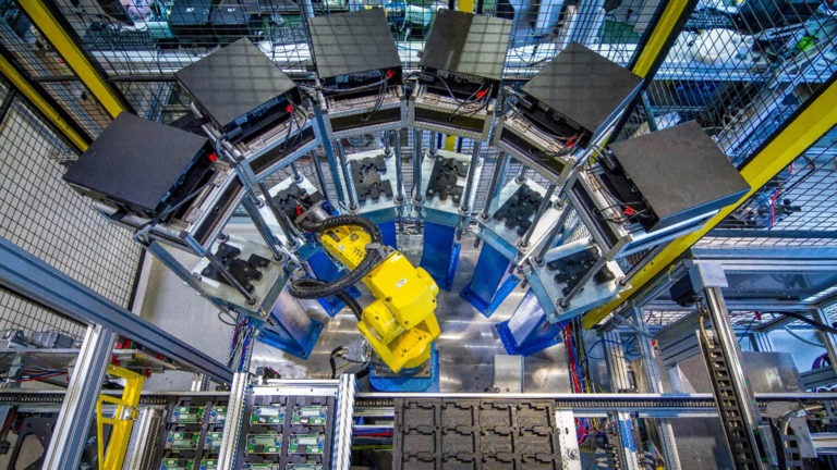 The picture shows robots sorting electronics